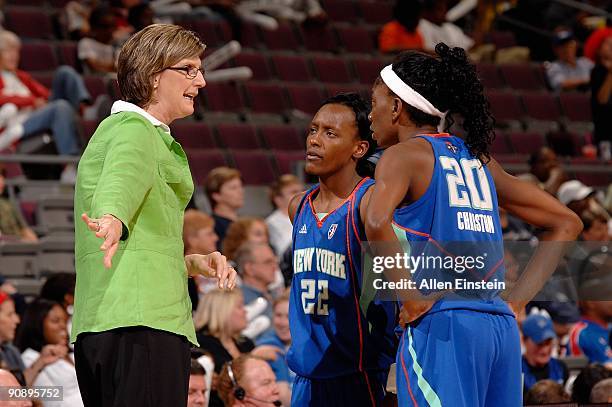 Head coach Anne Donovan talks to Ashely Battle and Shameka Christon of the New York Liberty during the WNBA game against the Detroit Shock on...