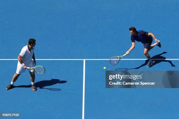 Jacco Eltingh of the Netherlands and Paul Haarhuis of the Netherlands compete in their legend's match against Thomas Enqvist of Sweden and Todd...