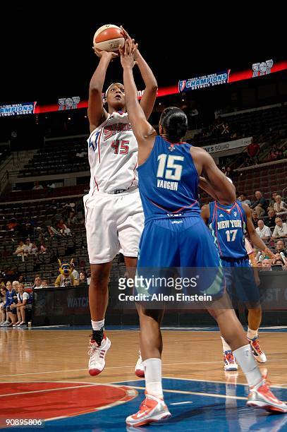 Kara Braxton of the Detroit Shock goes up for a shot over Kia Vaughn of the New York Liberty during the WNBA game on September 10, 2009 at The Palace...