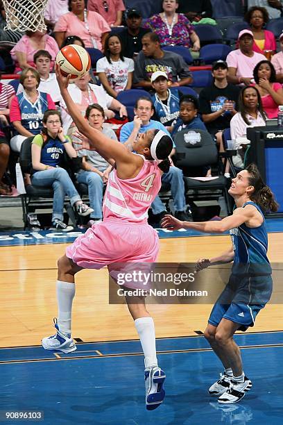 Marissa Coleman of the Washington Mystics takes the ball to the basket against Kelly Miller of the Minnesota Lynx during the game at the Verizon...