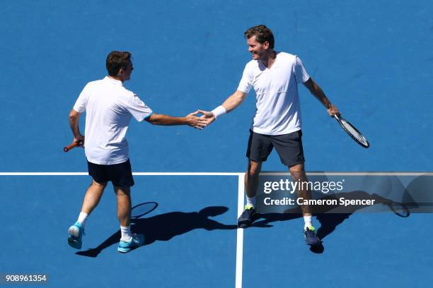 Todd Woodbridge of Australia and Thomas Enqvist of Sweden compete in their legend's match against Jacco Eltingh of the Netherlands and Paul Haarhuis...