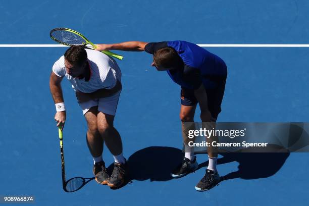 Jacco Eltingh of the Netherlands and Paul Haarhuis of the Netherlands compete in their legend's match against Thomas Enqvist of Sweden and Todd...