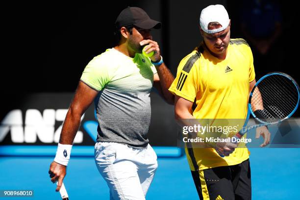 Aisam-Ul-Haq Qureshi of Pakistan and Marcin Matkowski of Poland compete in their legend's doubles match against Bob Bryan of the United States and...