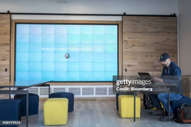 Customer works on a laptop computer at the Capital One Financial Corp. Cafe in the Lincoln Park neighborhood of Chicago, Illinois, U.S., on Thursday,...