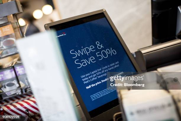 Digital sign advertises half off coffee at the Capital One Financial Corp. Cafe in the Lincoln Park neighborhood of Chicago, Illinois, U.S., on...