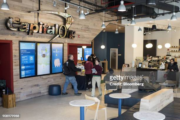 Customers walk through the Capital One Financial Corp. Cafe in the Lincoln Park neighborhood of Chicago, Illinois, U.S., on Thursday, Jan. 18, 2018....