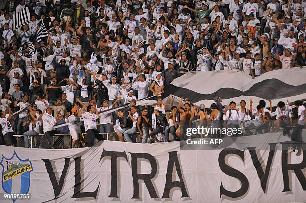 Fans of Comunicaciones cheer before their Concacaf Champions Leangue Football match againts Real España of Honduras in Guatemala City, on September...