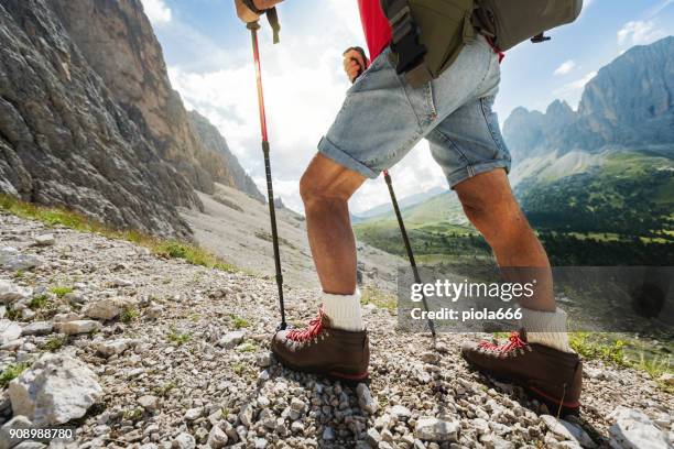 senior man trail hiking on the dolomites - leather shoe stock pictures, royalty-free photos & images