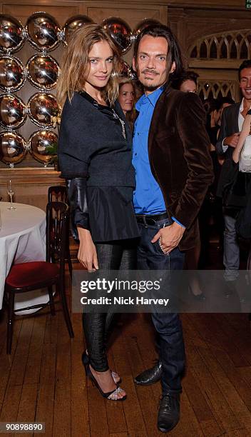 Model Natalia Vodianova and fashion designer Matthew Williamson attend Mika's album launch party on September 17, 2009 in London, England.