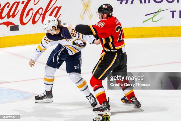 Nathan Beaulieu of the Buffalo Sabres and Curtis Lazar of the Calgary Flames get into a fight in an NHL game on January 22, 2018 at the Scotiabank...