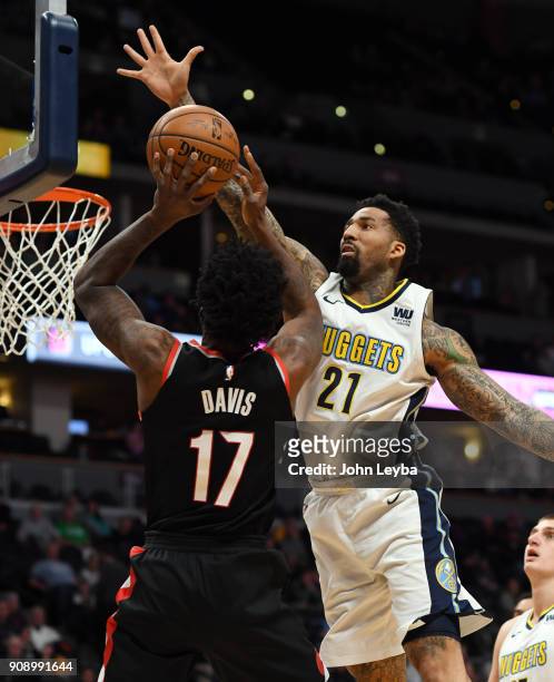Denver Nuggets forward Wilson Chandler goes up to block a shot by Portland Trail Blazers forward Ed Davis during the first quarter on January 22,...