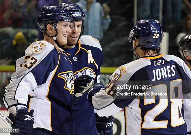 Center Colin Wilson, defenseman Shea Weber, and left wing Ryan Jones of the Nashville Predators celebrate a goal against the Atlanta Thrashers during...