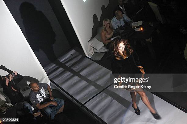 Model walks the runway at the Keka Spring 2010 collection presentation at Nikki Beach on September 17, 2009 in New York City.