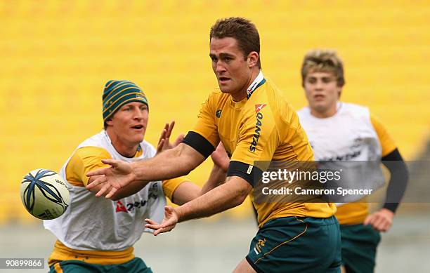 James Horwill of the Wallabies passes the ball during an Australian Wallabies Captain's run at Westpac Stadium on September 18, 2009 in Wellington,...