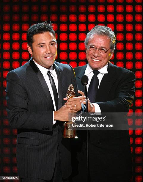 Boxer Oscar De La Hoya accepts the Special Achievement in Sports Television award from Edward James Olmos during the 2009 ALMA Awards held at Royce...