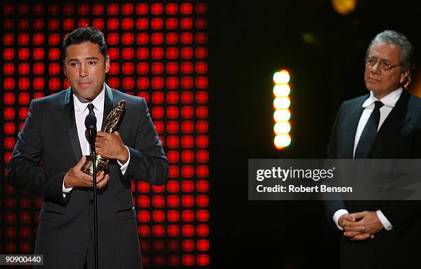 Boxer Oscar De La Hoya accepts the Special Achievement in Sports Television award from Edward James Olmos during the 2009 ALMA Awards held at Royce...