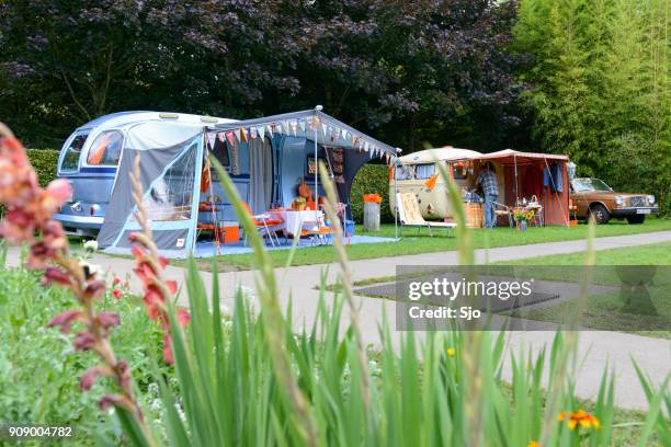 classic caravans camping in a park in vintage style - sjoerd van der wal or sjo stock pictures, royalty-free photos & images