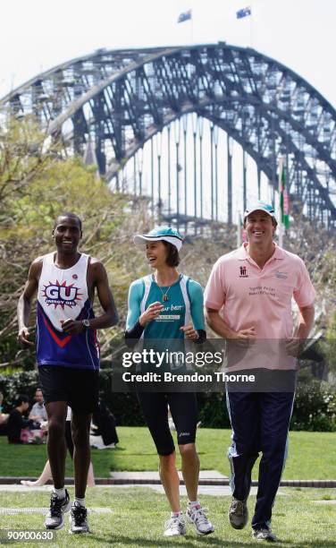 Josphat Mwangi, Antonia Kidman and Glenn McGrath run during a photo call ahead of Sunday's Blackmores Sydney Running Festival, welcoming the official...