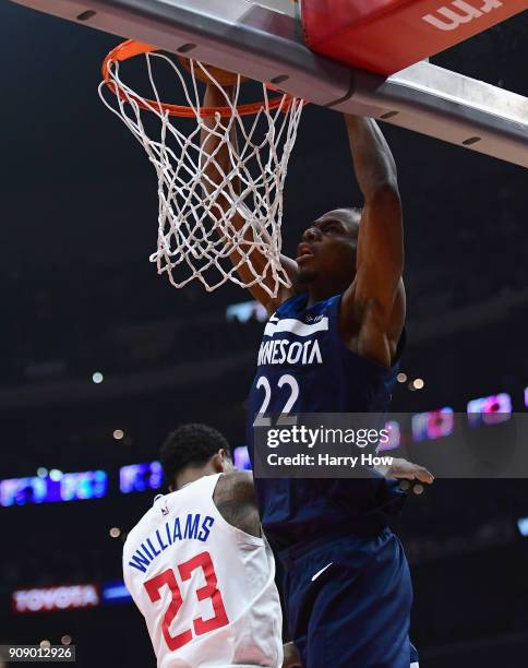 Andrew Wiggins of the Minnesota Timberwolves dunks over Lou Williams of the LA Clippers during the first half at Staples Center on January 22, 2018...