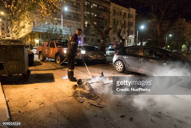 Firefighter extinguishes a fire set during Leftist groups demonstration in Thessaloniki, Greece, on 22 January 2018. An antifa-occupied building...