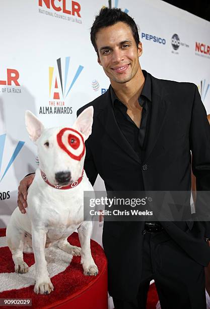Actor Matt Cedeno poses with Bullseye, the Target dog, at the 2009 ALMA Awards held at Royce Hall on September 17, 2009 in Los Angeles, California.