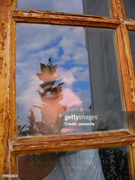 man looking through  window - covilha stock pictures, royalty-free photos & images