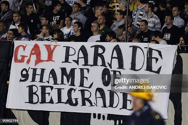 Banner referring to the upcoming gay pride parade is displayed amongst supporters of Partizan Belgrade FC, during the UEFA Europa league football...