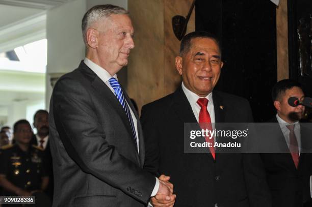 Secretary of Defense James Mattis shakes hands with Indonesian Defense Minister Ryamizard Ryacudu as they pose for a photo after their meeting at...