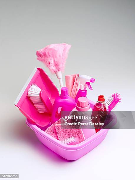 pink cleaning materials in pink bowl. - dustpan and brush stockfoto's en -beelden