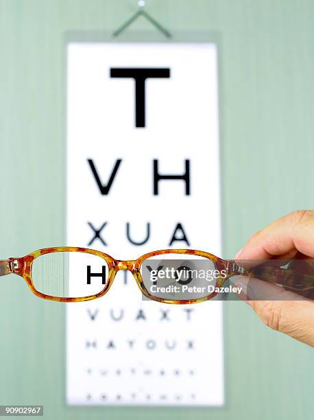 eye test chart with glasses. - eye chart stock pictures, royalty-free photos & images