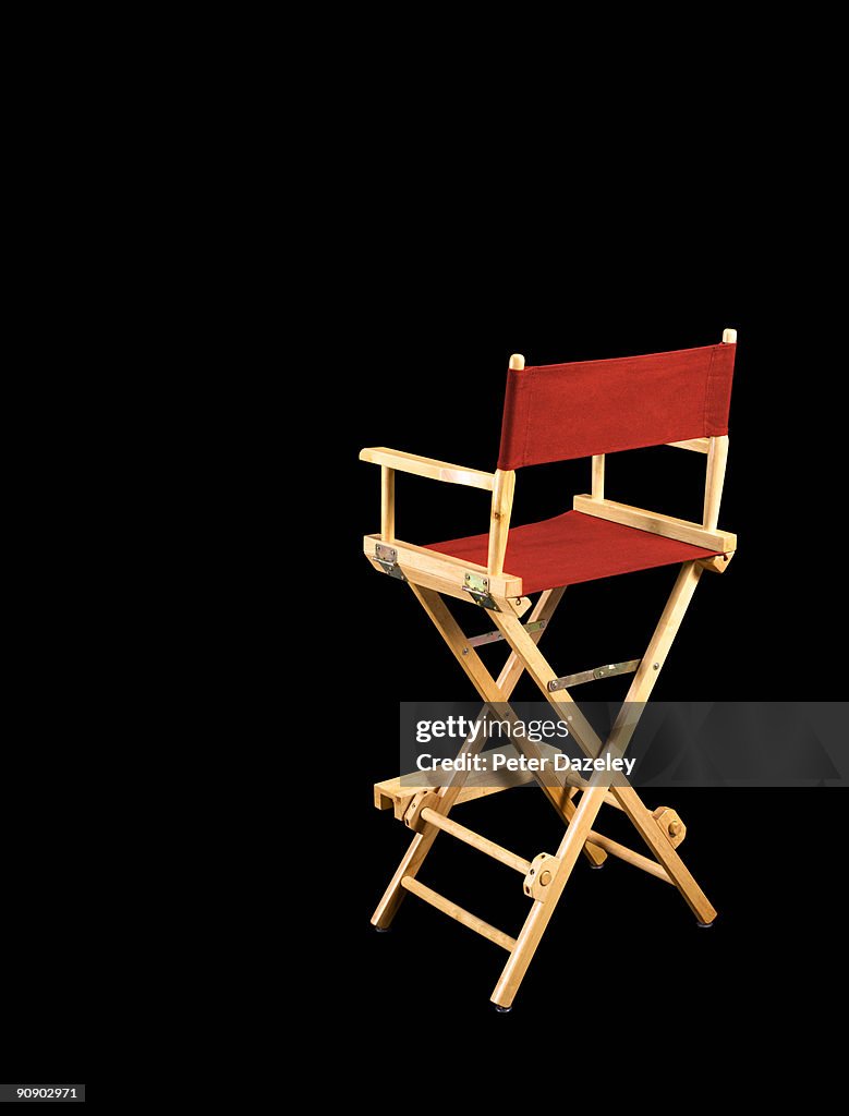 Directors chair on black background.