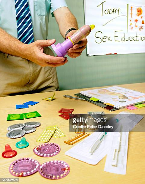 teacher teaching sex education in school. - teaching aids stock pictures, royalty-free photos & images
