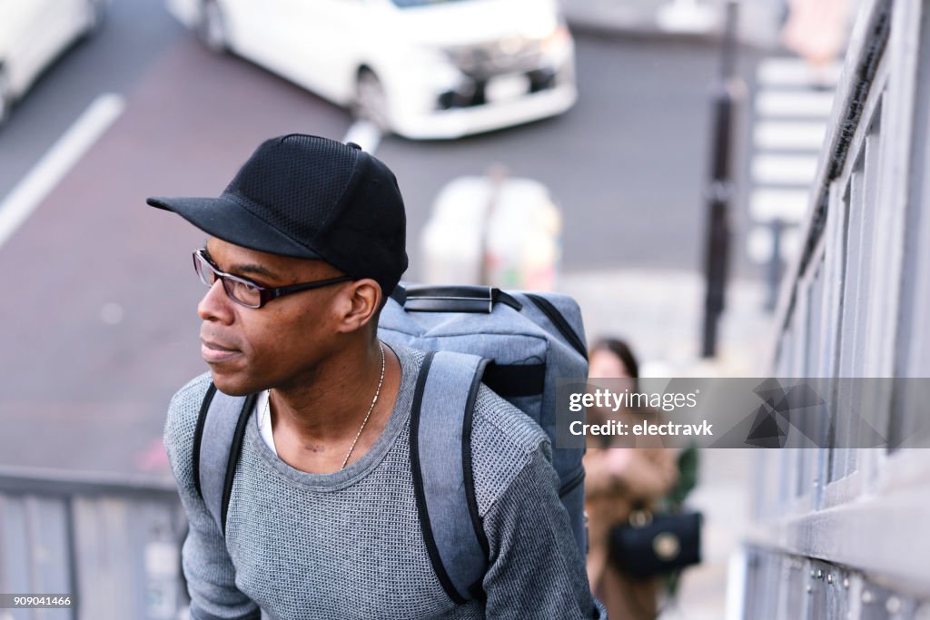 Man walking up a set of stairs