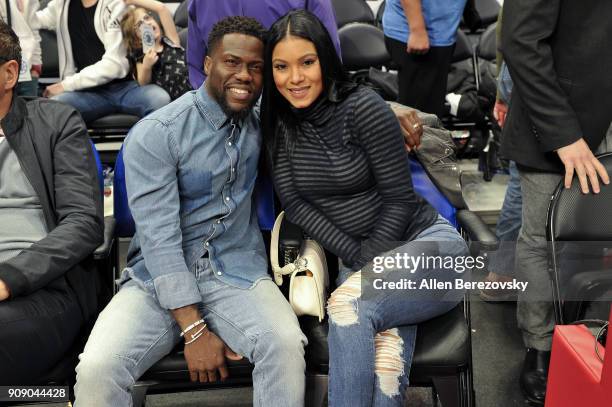 Actor Kevin Hart and Eniko Parrish attends a basketball game between the Los Angeles Clippers and the Minnesota Timberwolves at Staples Center on...