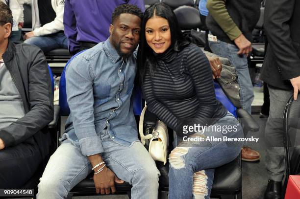 Actor Kevin Hart and Eniko Parrish attends a basketball game between the Los Angeles Clippers and the Minnesota Timberwolves at Staples Center on...