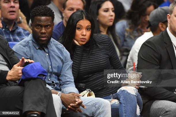 Actor Kevin Hart and Eniko Parrish attends a basketball game between the Los Angeles Clippers and the Minnesota Timberwolves at Staples Center on...