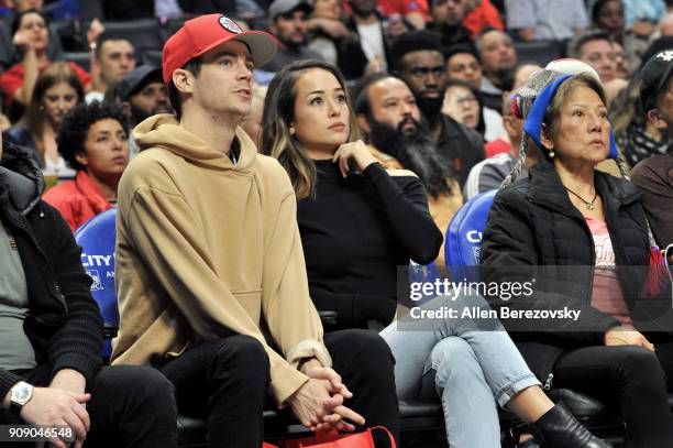 Actor Grant Gustin and Andrea "LA" Thoma attend a basketball game between the Los Angeles Clippers and the Minnesota Timberwolves at Staples Center...