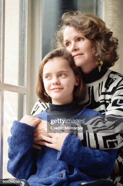 Year old Christina Ricci, junior star in the blockbuster movie 'The Addams Family', with her mother Sarah, 9th December 1991.