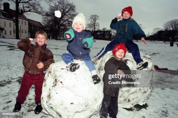 Having a ball are youngsters Matthew Thompson, Joshua McGhern, Jonathan McGhern and Craig McGhern, on Norton Green, 1st January 1997.