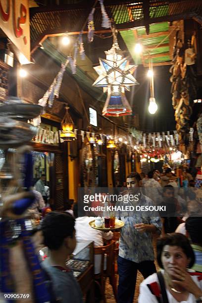 Cairo's landmark Fishawi cafe in the Egyptian capital's Islamic quarter is packed with customers late on September 17 on the eve of the last Friday...