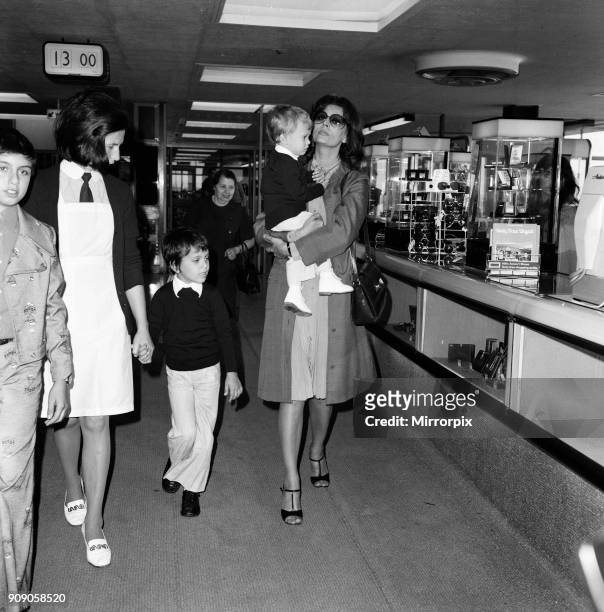 Italian actress Sophia Loren and her two children leaving Heathrow Airport for Rome. August 1974.