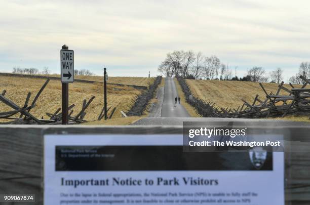 Couple walks up a closed road during a government shutdown at Antietam National Battlefield on January 22, 2018 in Sharpsburg, Md.