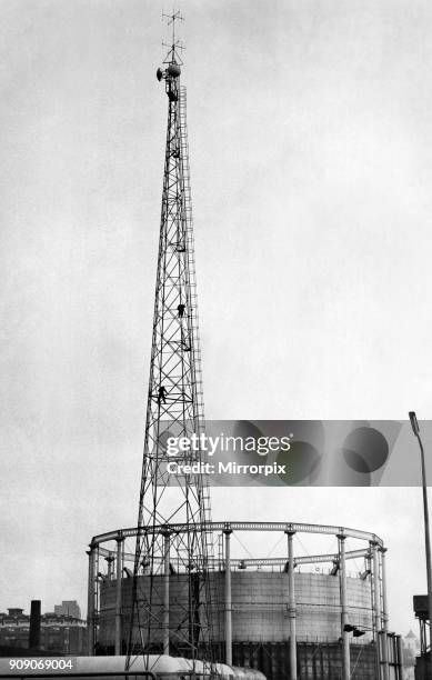 Men balance precariously 100ft up the radio mast at Gaythorn Gas Works, 26th November 1970.