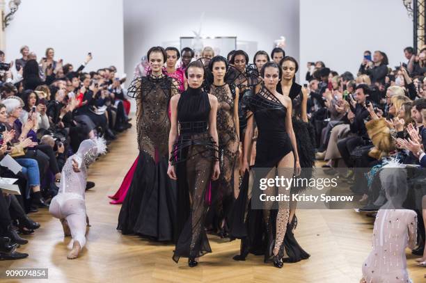 Models walk the runway during the On Aura Tout Vu Spring Summer 2018 show as part of Paris Fashion Week on January 22, 2018 in Paris, France.