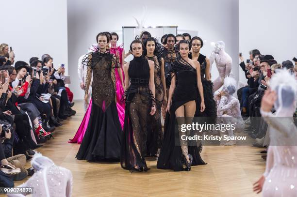 Models walk the runway during the On Aura Tout Vu Spring Summer 2018 show as part of Paris Fashion Week on January 22, 2018 in Paris, France.