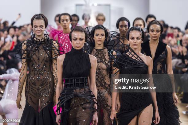 Models walk the runway during the On Aura Tout Vu Spring Summer 2018 show as part of Paris Fashion Week on January 22, 2018 in Paris, France.