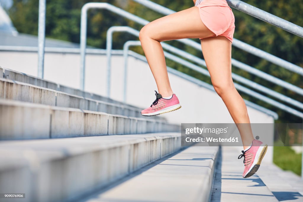 Close-up of woman running on stairs
