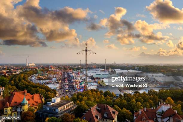 germany, bavaria, munich, view of beer fest fair on theresienwiese in the evening - theresienwiese stock pictures, royalty-free photos & images