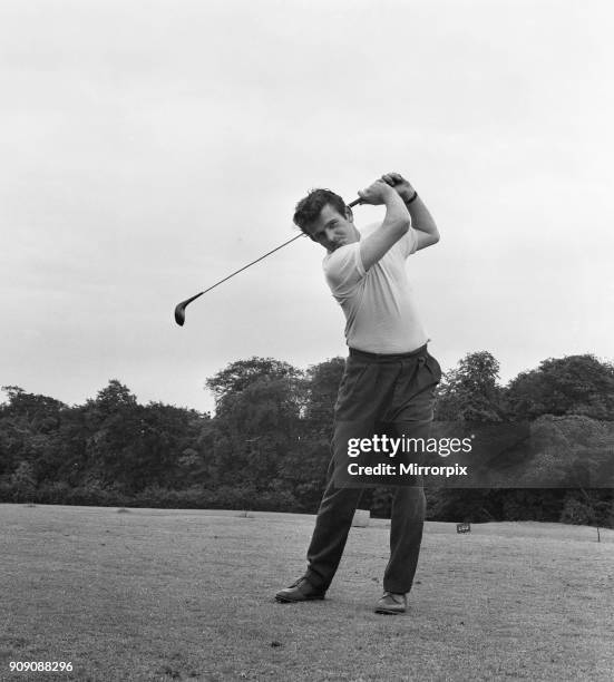 Liverpool goalkeeper Tommy Lawrence enjoying a round of golf at Leigh Golf Club ahead of his wedding. 14th July 1963.