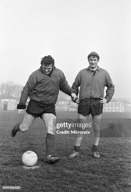 Liverpool goalkeeper Tommy lawrence practices his penalty kicks with the club's leading goalsorer Roger Hunt during a training session at Melwood....